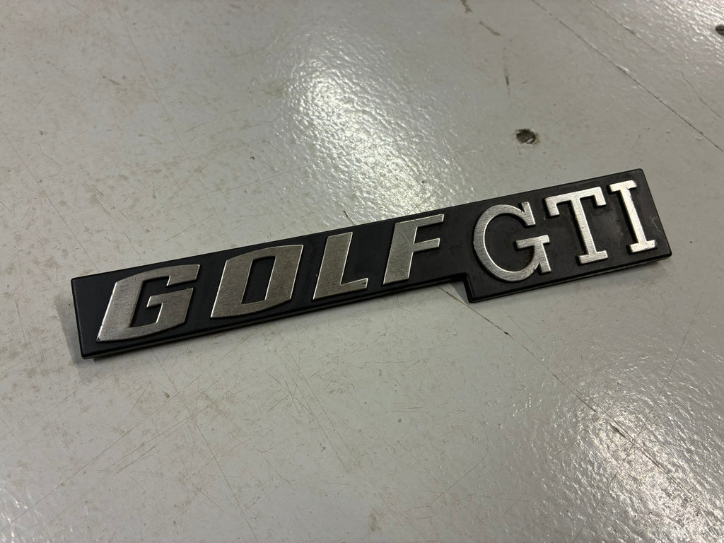VW Mk1 Golf GTi Merking | Genuine Volkswagen Mk1 Golf GTI rear tailgate logo.